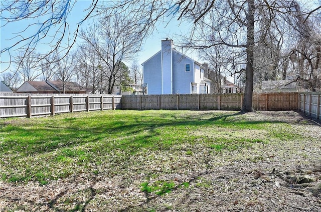 view of yard with a fenced backyard