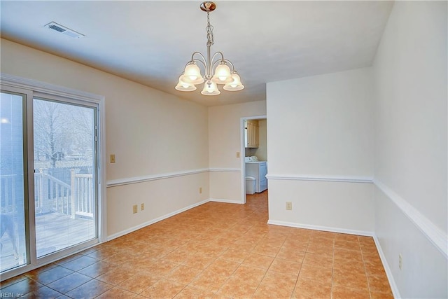 unfurnished room with visible vents, washer / clothes dryer, baseboards, a healthy amount of sunlight, and a chandelier