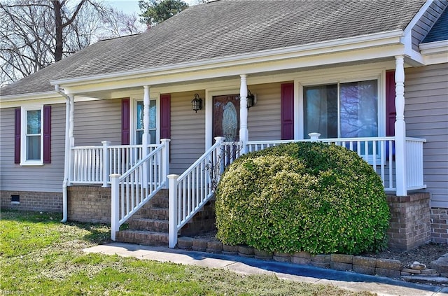 view of front facade featuring crawl space, a porch, and a shingled roof