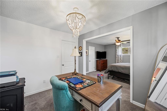 carpeted bedroom with an inviting chandelier, a textured ceiling, and baseboards