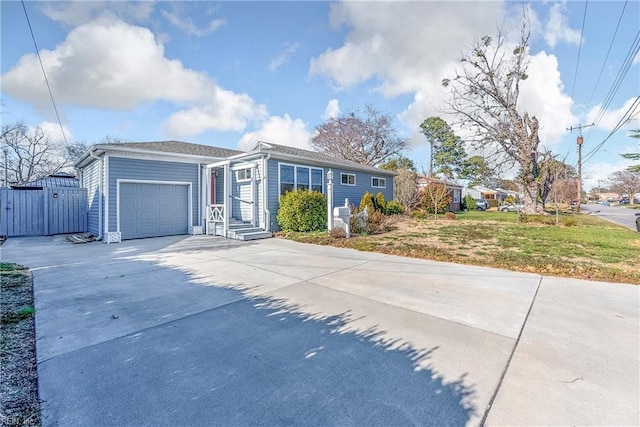 single story home featuring an attached garage and driveway