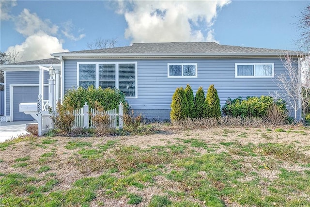 exterior space with an attached garage and driveway