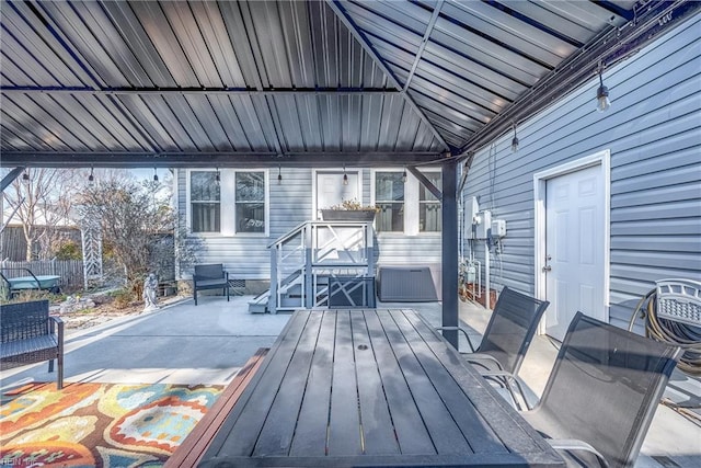 wooden terrace featuring a patio