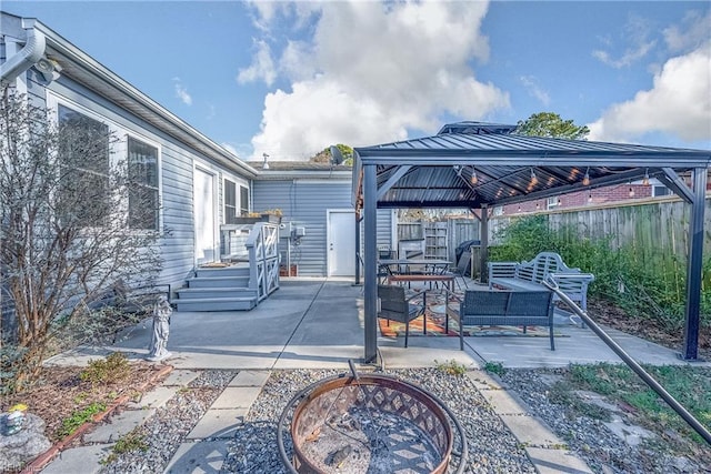 view of patio / terrace featuring a gazebo and fence