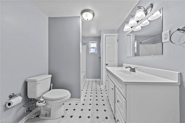 bathroom with tile patterned floors, toilet, baseboards, bathing tub / shower combination, and vanity