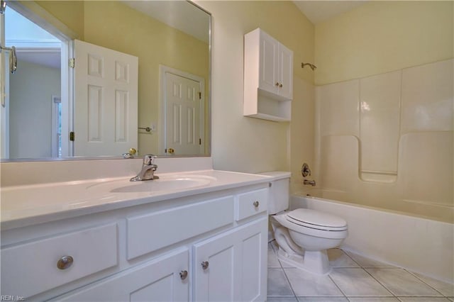 bathroom with tile patterned floors, shower / bathtub combination, toilet, and vanity