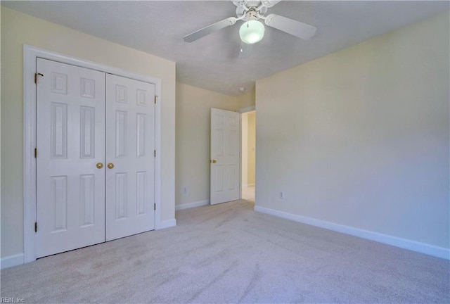 unfurnished bedroom featuring carpet, a closet, and baseboards