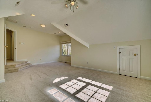 empty room with recessed lighting, visible vents, light colored carpet, and baseboards