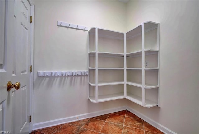 spacious closet with tile patterned floors