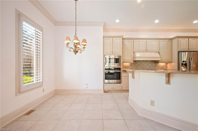 kitchen with visible vents, custom range hood, a kitchen breakfast bar, appliances with stainless steel finishes, and decorative backsplash