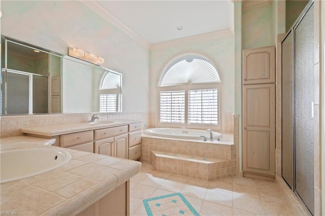 bathroom featuring vanity, a shower stall, crown molding, and a healthy amount of sunlight