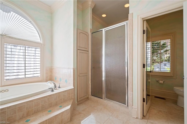 full bathroom with visible vents, a shower stall, toilet, a garden tub, and tile patterned floors