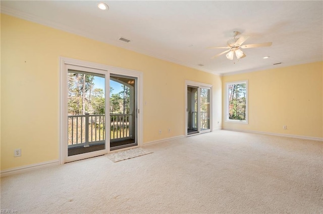 unfurnished room featuring ornamental molding, baseboards, and carpet floors