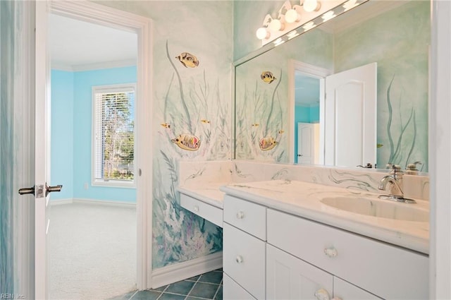 bathroom featuring baseboards, vanity, and crown molding