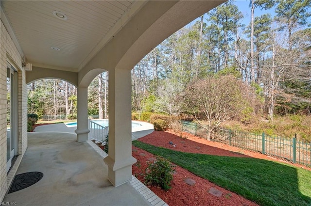 view of patio / terrace featuring a fenced in pool and fence