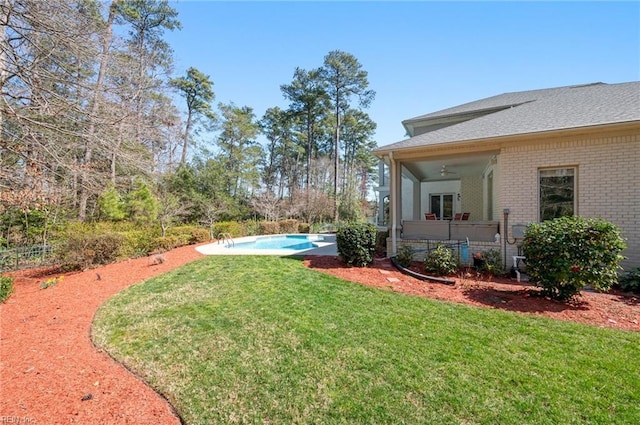 view of yard featuring a fenced in pool