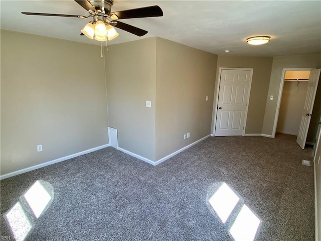 carpeted empty room with baseboards