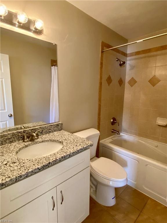 bathroom with tile patterned floors, vanity, toilet, and shower / tub combo with curtain