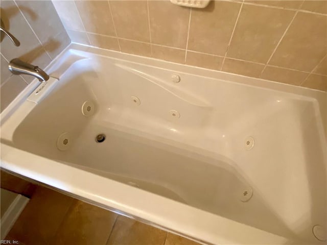 full bathroom featuring a whirlpool tub