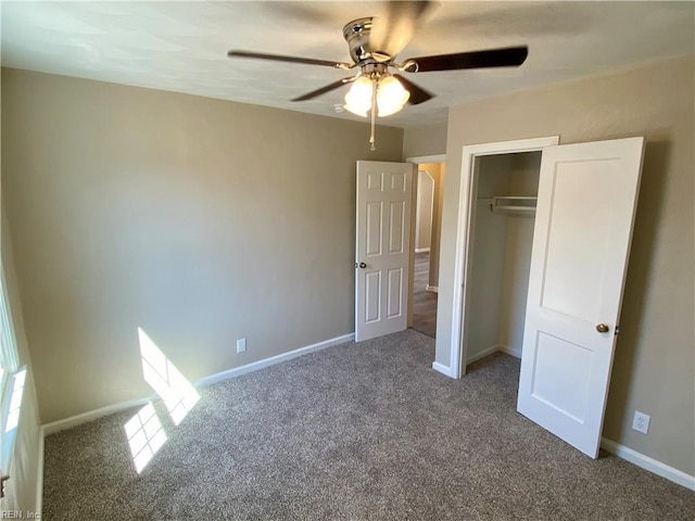 unfurnished bedroom featuring carpet, baseboards, and a closet