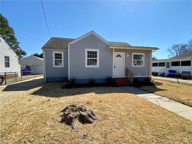 view of front of home featuring a front lawn, fence, and crawl space