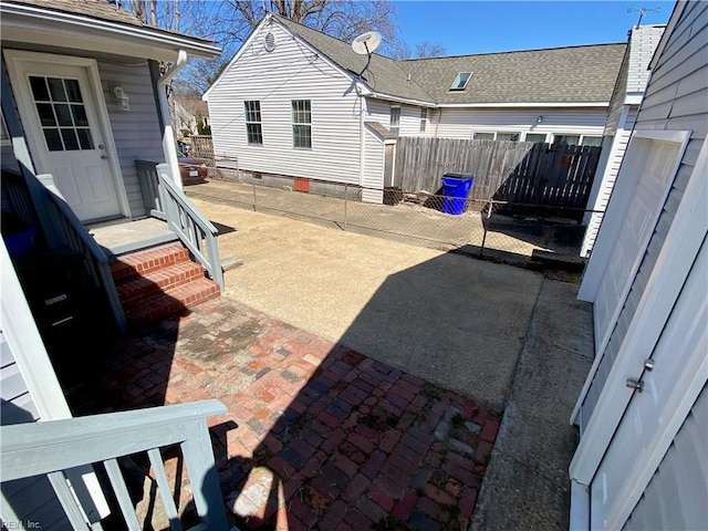 view of patio featuring fence