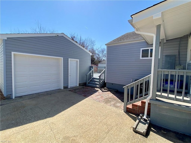 garage with concrete driveway