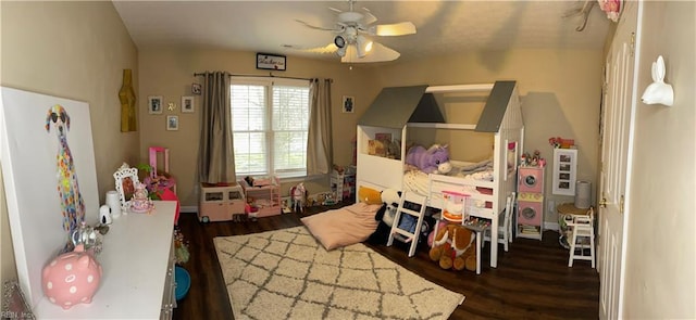 bedroom with ceiling fan and wood finished floors