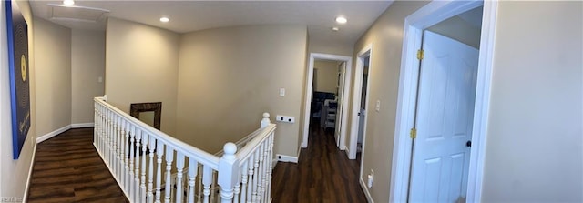 hall with recessed lighting, baseboards, an upstairs landing, and wood finished floors