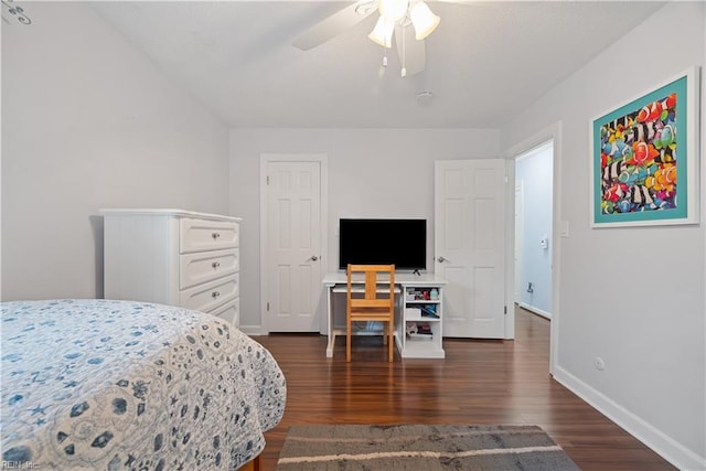 bedroom with a ceiling fan, baseboards, and dark wood-style flooring