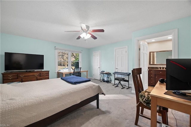 carpeted bedroom featuring baseboards, ceiling fan, a textured ceiling, and multiple closets