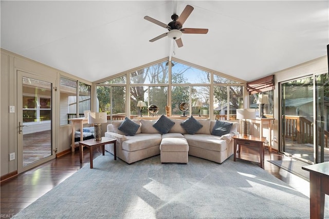 sunroom featuring a ceiling fan, lofted ceiling, and a healthy amount of sunlight