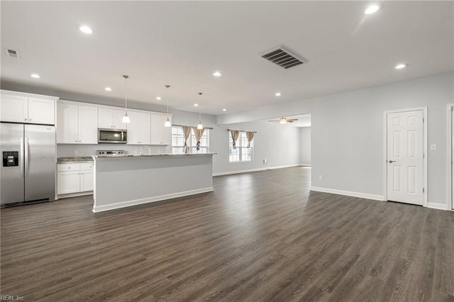 kitchen featuring open floor plan, dark wood-style floors, visible vents, and appliances with stainless steel finishes