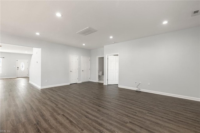 interior space featuring recessed lighting, baseboards, and dark wood-style flooring