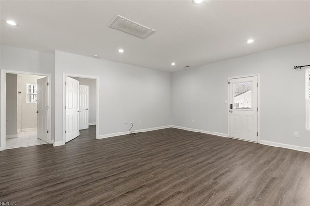 unfurnished room featuring recessed lighting, baseboards, and dark wood-style flooring