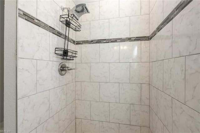 details featuring tiled shower