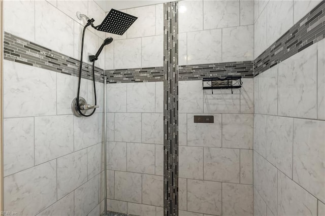 bathroom with a tile shower