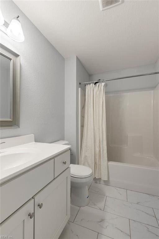 full bath featuring visible vents, shower / bath combo with shower curtain, toilet, marble finish floor, and vanity