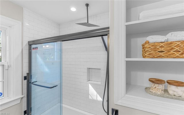 full bathroom featuring recessed lighting and a shower stall