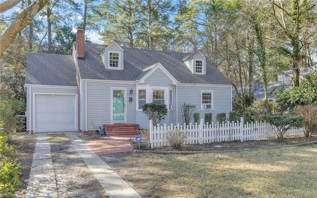 cape cod-style house featuring a chimney, concrete driveway, an attached garage, and fence