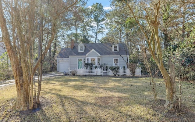 cape cod-style house featuring a front yard, an attached garage, fence, and a chimney