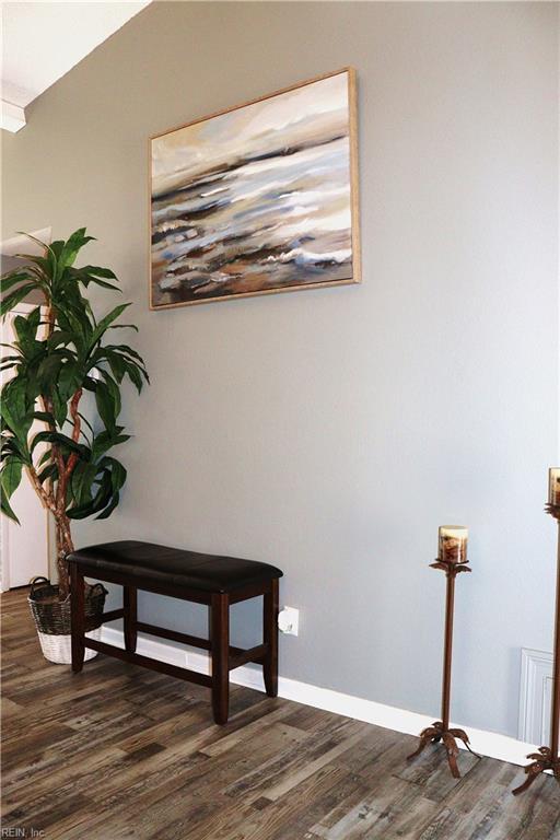 details with wood finished floors and baseboards