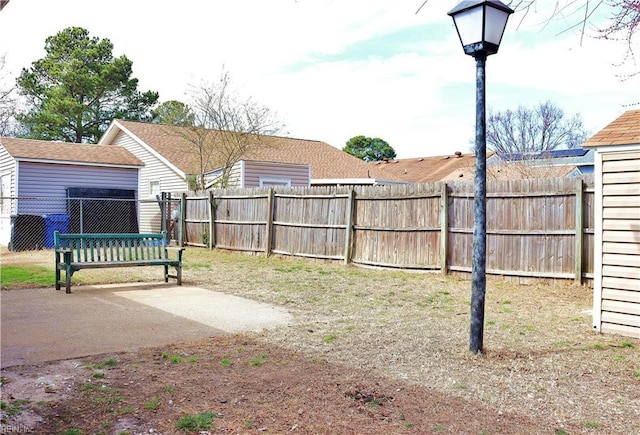 view of yard with a patio area and a fenced backyard