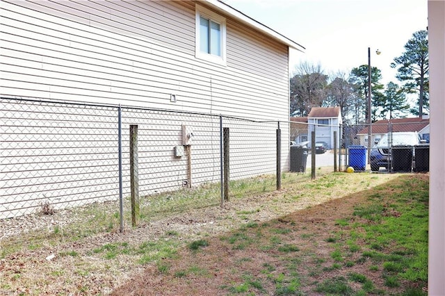 view of property exterior featuring fence