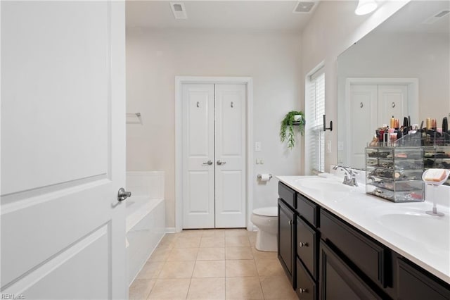 bathroom featuring tile patterned floors, visible vents, a sink, double vanity, and a bath