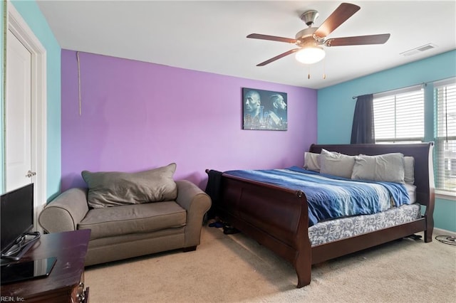 bedroom with baseboards, visible vents, carpet floors, and ceiling fan