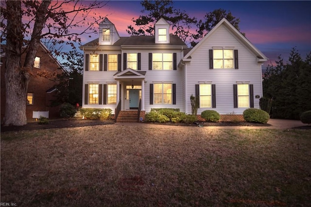 view of front of home with a lawn