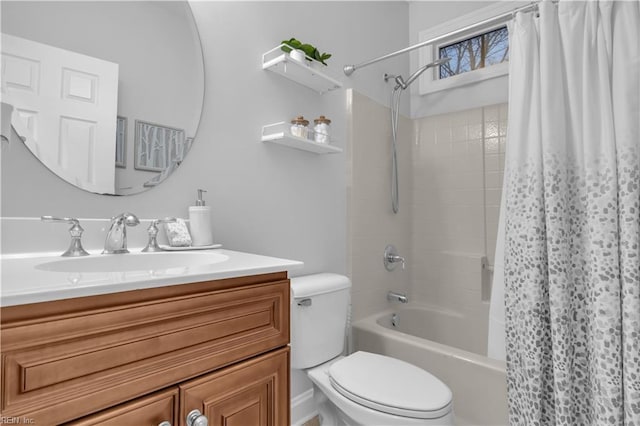 full bath with shower / bath combo with shower curtain, toilet, and vanity