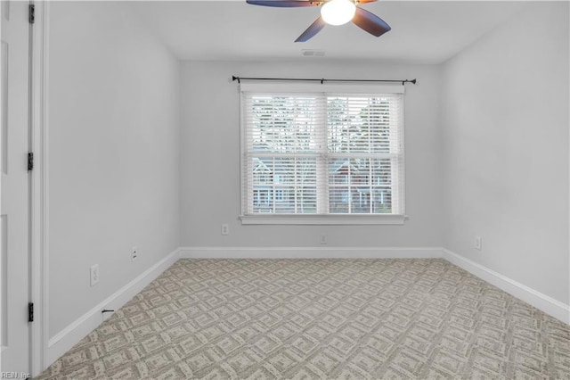 empty room featuring visible vents, baseboards, carpet, and ceiling fan