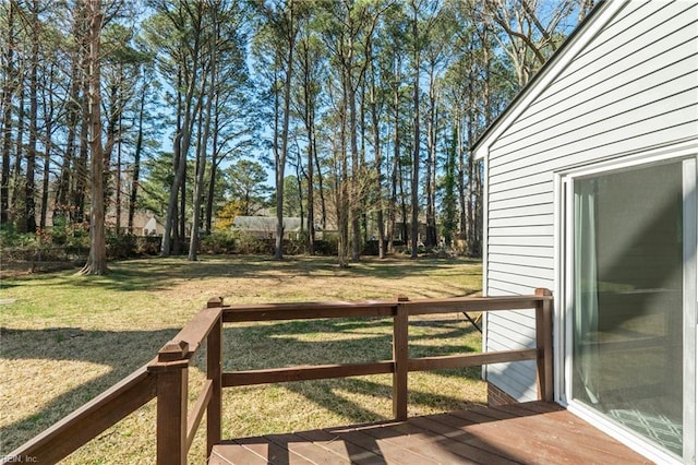 view of yard with a wooden deck and fence